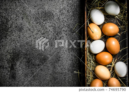 Fresh eggs in an old box. Fresh eggs in an old box. 74695790