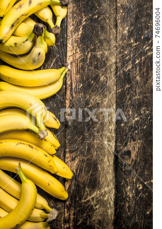 Ripe bunches of bananas. 74696004