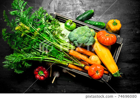 Organic food. Fresh vegetables in an old box. 74696080