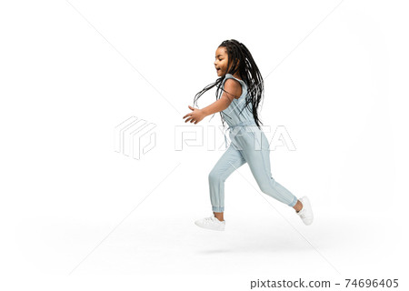 Happy longhair brunette little girl isolated on white studio background. Looks happy, cheerful, sincere. Copyspace. Childhood, education, emotions concept Happy longhair brunette little girl isolated on white studio background. Looks happy, cheerful, sincere. Copyspace. Childhood, education, emotions concept 74696405