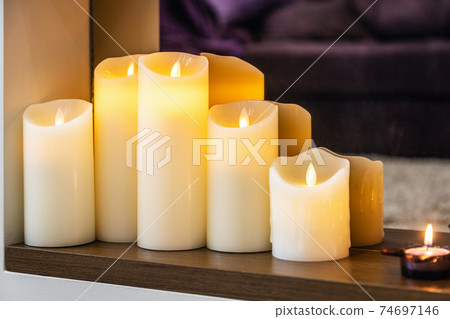 Modern interior of the house. focus on the led electric flame 74697146