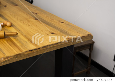 Oak kitchen worktop with special thickness on kitchen table. Oak kitchen worktop with special thickness on kitchen table. 74697287