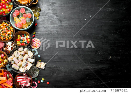 Different sweet candy, jelly and candied in a bowl. 74697981