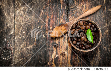 Coffee beans in a bowl. Coffee beans in a bowl. 74698014
