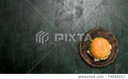 Fresh burger with beef, bacon and fresh vegetables. 74698052