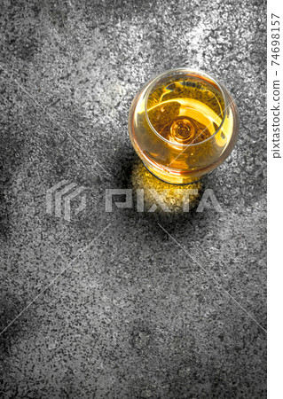 glass of French cognac. 74698157