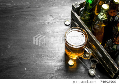 Fresh beer in an old box. 74698500