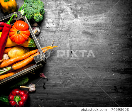 Organic food. Fresh vegetables in an old box. Organic food. Fresh vegetables in an old box. 74698608