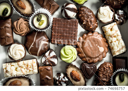 Chocolate candies in box. 74698757