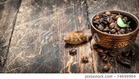 Coffee beans in a bowl. Coffee beans in a bowl. 74698904