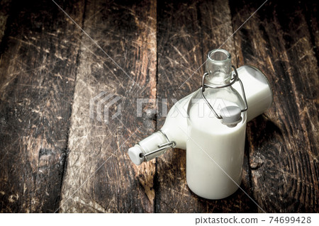 Bottles with fresh milk. Bottles with fresh milk. 74699428