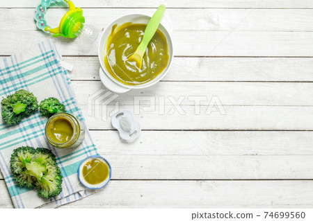 Baby food. Baby puree from broccoli. 74699560