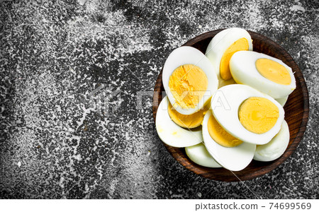 Boiled eggs in a bowl. Boiled eggs in a bowl. 74699569