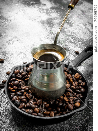 Fresh coffee in the Turk. Fresh coffee in the Turk. 74699792