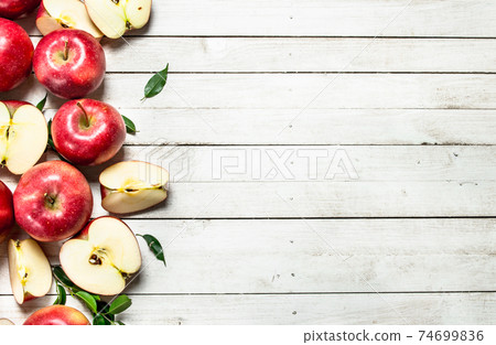 Fresh red apples with leaves. 74699836