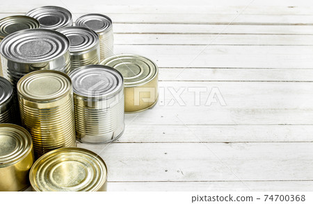 Tin cans with food. Tin cans with food. 74700368