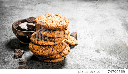 Oatmeal cookies with chocolate in a bowl. Oatmeal cookies with chocolate in a bowl. 74700369