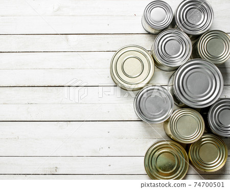 Tin cans with food. 74700501