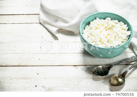 Cottage cheese from fresh milk in a bowl. Cottage cheese from fresh milk in a bowl. 74700538