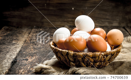 Fresh eggs in a basket. Fresh eggs in a basket. 74700639