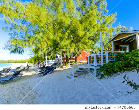 Colorful tropical cabanas or shelters on the beach of Half Moon Cay 74700663