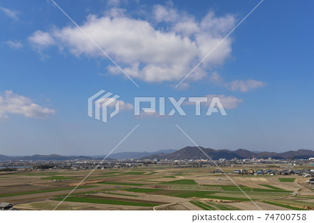 Agricultural land seen from a hill 74700758