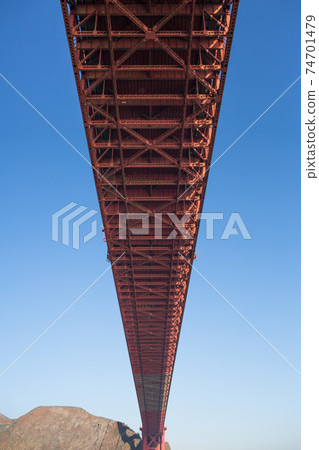 San Francisco's Golden Gate Bridge, a view from below as seen from the ship. San Francisco's Golden Gate Bridge, a view from below as seen from the ship. 74701479