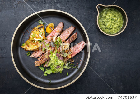 Barbecue dry aged wagyu flank steak with pineapples Barbecue dry aged wagyu flank steak with pineapples 74701637