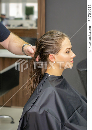 Woman with wet long hair Woman with wet long hair 74701911