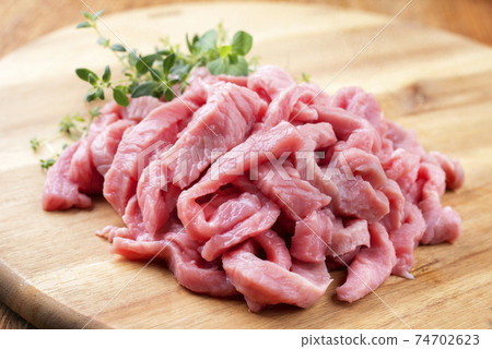 Raw veal strips for traditional Swiss zurcher geschnetzeltes Raw veal strips for traditional Swiss zurcher geschnetzeltes 74702623