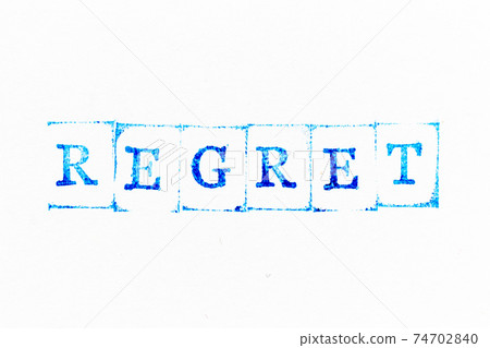 Blue color ink rubber stamp in word regret on white paper background 74702840