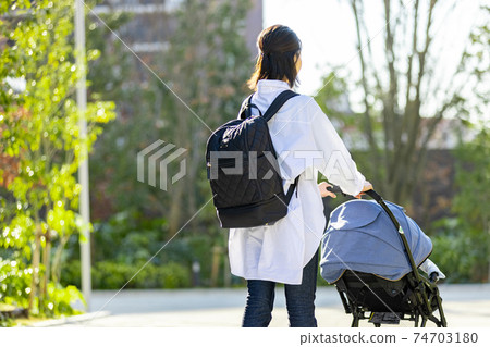 Young woman traveling in a stroller 74703180