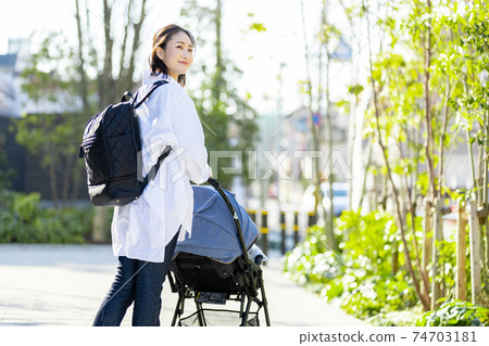 Young woman traveling in a stroller 74703181