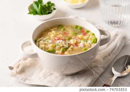 Homemade soup with ditalini pasta and vegetables. 74703853