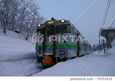 Train stopped at Shiokari Station in Wassamu, Hokkaido 74703916