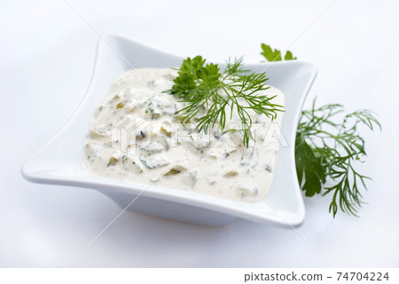 Modern style German remoulade with gherkin and dill 74704224
