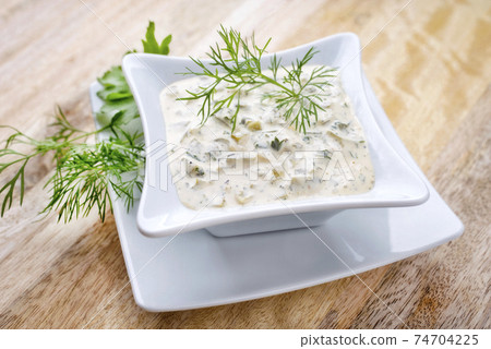 Modern style German remoulade with gherkin and dill 74704225
