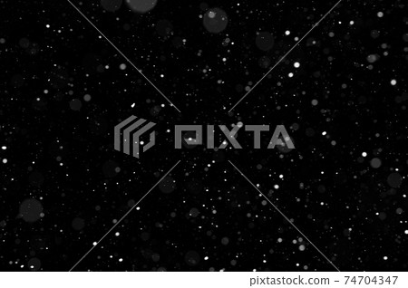 Bokeh of white snow on a black background. Snowfall - design element. Bokeh of white snow on a black background. Snowfall - design element. 74704347