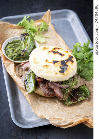 Colombian arepa con carne desmechada with shredded beef steak Colombian arepa con carne desmechada with shredded beef steak 74704396
