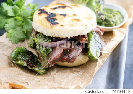 Colombian arepa con carne desmechada with shredded beef steak 74704400