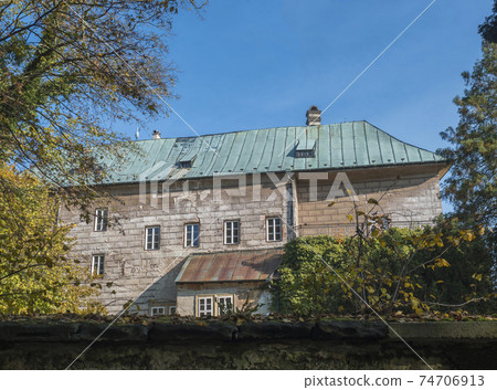Medieval early Gothic Castle Houska in north Bohemia in autumn time, Czech republic. Houska Castle is one of the best preserved castles of the period. Sunny day blue sky. 74706913