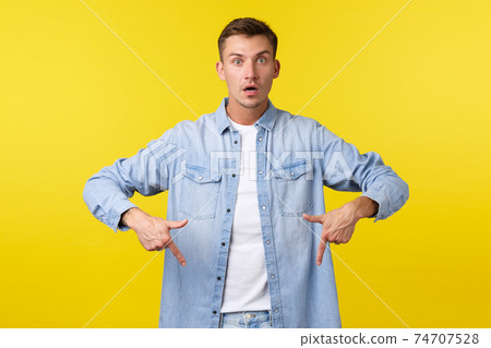 Shocked And Alarmed Handsome Blong Guy Asking Stock Photo