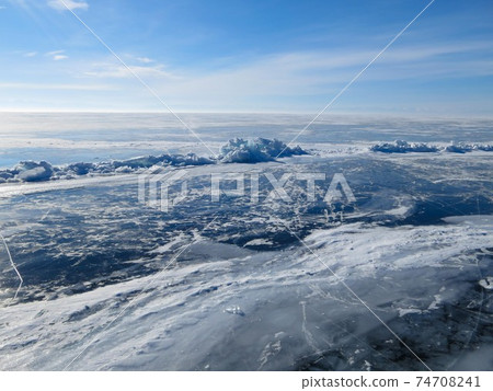 Colorful ice in winter on Lake Baikal in February 74708241