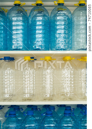 many bottles water lid handle standing row 74710085