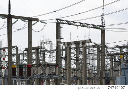 Power plant is a station of transformation. A lot of cables, poles and wires, transformers. Electro-energy. 74710407
