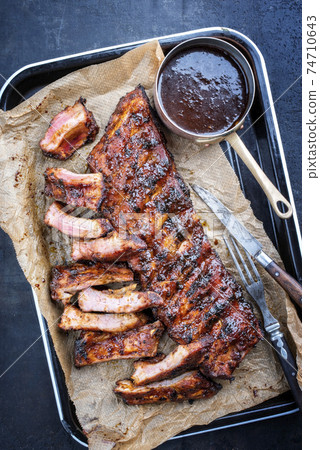 Barbecue spare ribs St Louis style with hot honey chili marinade 74710643