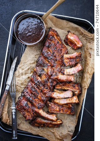 Traditional barbecue spare ribs St Louis style with hot honey chili marinade 74710644