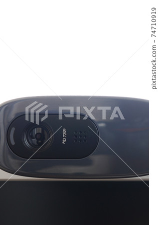 A modern web camera is installed on the body of a flat screen monitor. Device for video communication and recording of high quality video A modern web camera is installed on the body of a flat screen monitor. Device for video communication and recording of high quality video 74710919