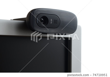 A modern web camera is installed on the body of a flat screen monitor. Device for video communication and recording of high quality video A modern web camera is installed on the body of a flat screen monitor. Device for video communication and recording of high quality video 74710951