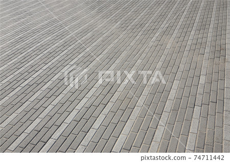The cobblestones road in town square. Background texture in perspective The cobblestones road in town square. Background texture in perspective 74711442